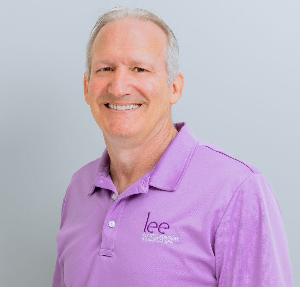 A headshot of Dr. Lee who performs breast augmentation in St. Lucie County