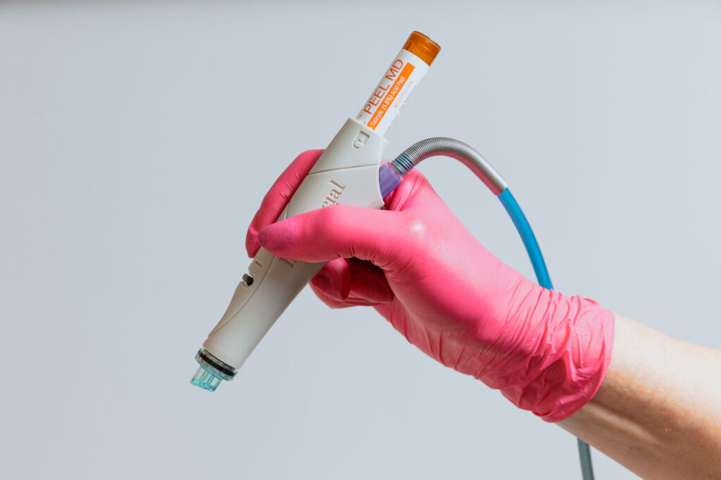A provider holds up a hydrafacial tool to complete one of our most popular facials in Port St. Lucie.